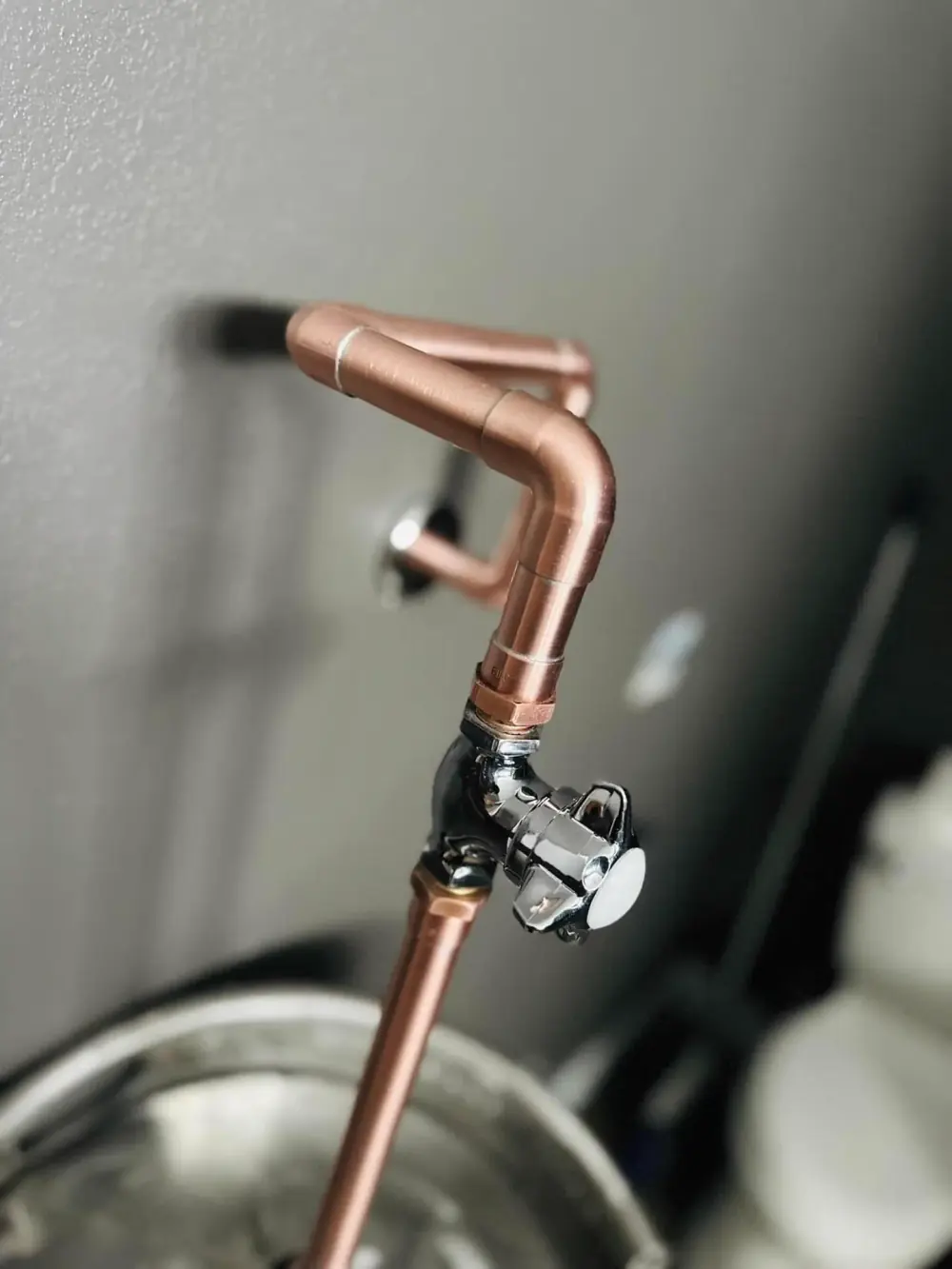 Closeup of plumbing valve work by Crest Plumbing