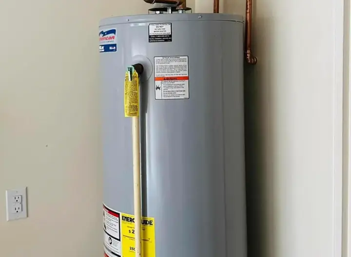 Tank water heater installed in a home closet by Crest Plumbing