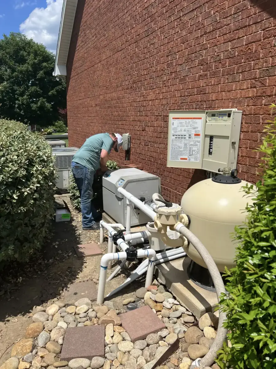 Outdoor whole-home water filtration equipment serviced by Crest Plumbing