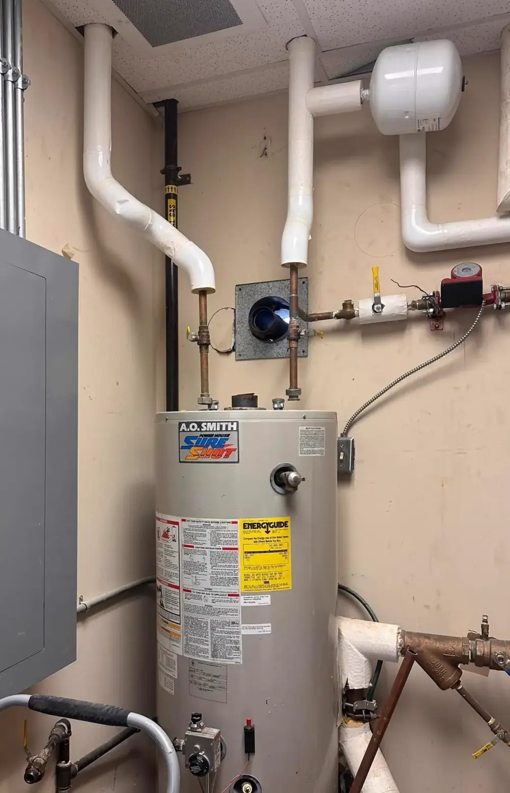 Tank water heater in a mechanical room
